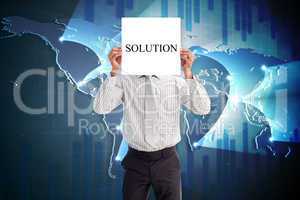 Businessman holding card saying solution