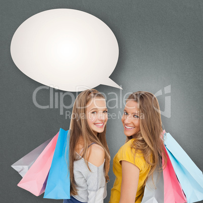 Composite image of two young women with shopping bags