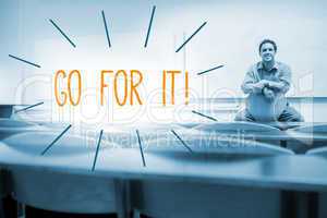 Go for it! against lecturer sitting in lecture hall