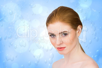 Composite image of beautiful redhead looking at camera