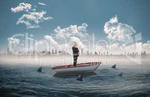 Composite image of happy businessman looking away in a sailboat