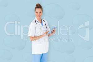 Composite image of pretty nurse using tablet pc