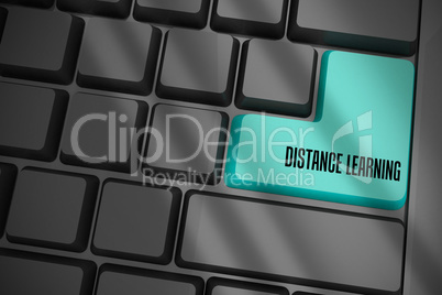 Distance learning on black keyboard with blue key