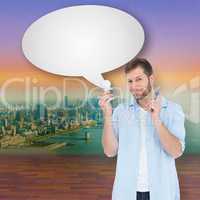 Composite image of charming model with speech bubble holding a b