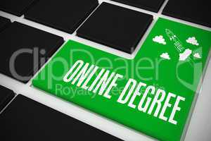 Online degree on black keyboard with green key