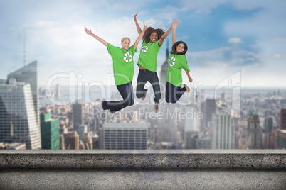 Composite image of enviromental activists jumping and smiling