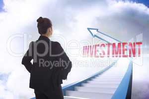 Investment against red staircase arrow pointing up against sky