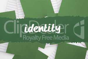Identity against green paper strewn over notepad