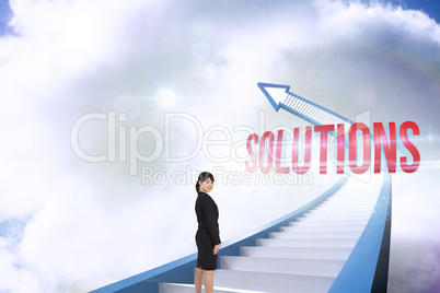 Solutions against red staircase arrow pointing up against sky