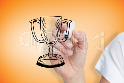 Composite image of businesswoman drawing winners cup