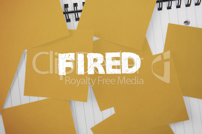 Fired against yellow paper strewn over notepad