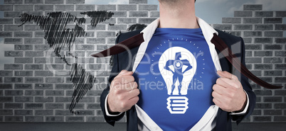 Composite image of businessman opening his shirt superhero style