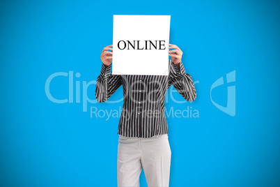 Businesswoman holding card saying online