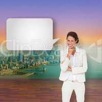 Composite image of thinking businesswoman with speech bubble