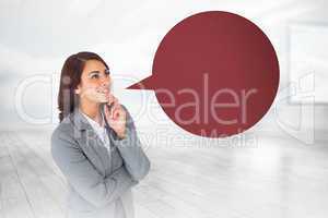 Composite image of smiling thoughtful businesswoman with speech