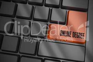Online degree on black keyboard with brown key
