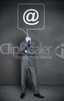 Headless businessman with at sign in speech bubble