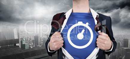 Composite image of businessman opening his shirt superhero style