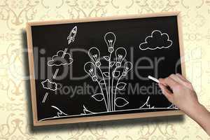 Composite image of hand drawing light bulb plant with chalk