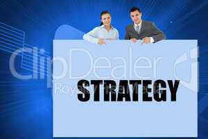 Business partners showing card saying strategy