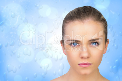 Composite image of serious blonde natural beauty