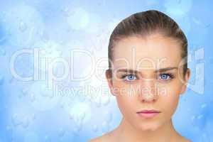 Composite image of serious blonde natural beauty