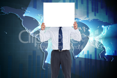 Composite image of businessman showing card