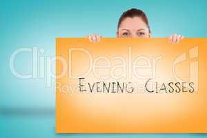 Pretty brunette showing card with evening classes