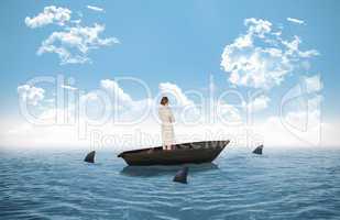 Composite image of thinking businesswoman in a sailboat