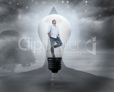 Composite image of thinking man in light bulb