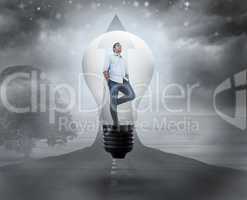 Composite image of thinking man in light bulb