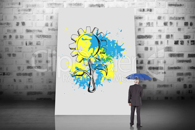 Composite image of businessman holding umbrella