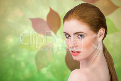 Composite image of beautiful redhead looking at camera Composite image of beautiful redhead looking at camera