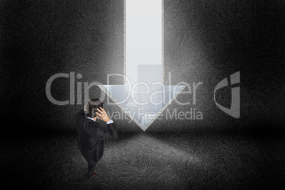 Composite image of stressed businessman with hands on head