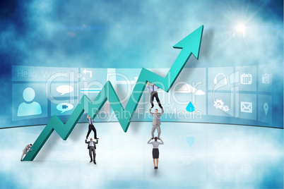 Composite image of business team holding up arrow