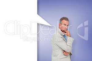 Composite image of thinking businessman with speech bubble