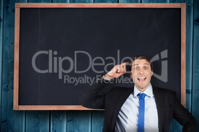 Composite image of thinking businessman scratching head