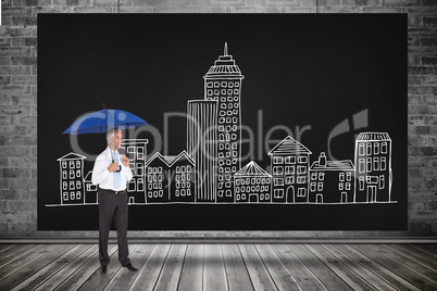 Composite image of happy businessman holding umbrella