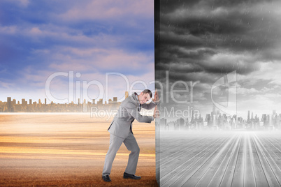 Composite image of businessman pushing away scene