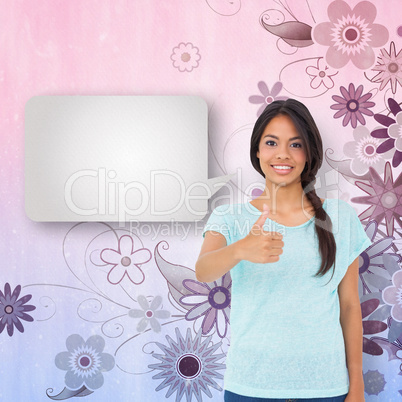 Composite image of happy brunette giving thumbs up with speech b