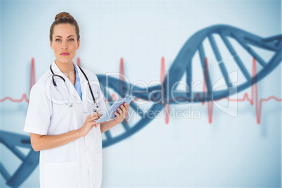 Composite image of pretty nurse using tablet pc