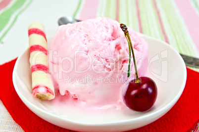 Ice cream cherry on red paper napkin with waffles