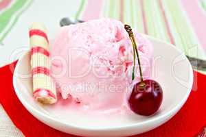 Ice cream cherry on red paper napkin with waffles