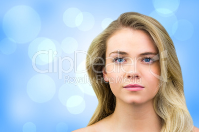 Composite image of serious blonde natural beauty