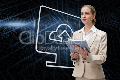 Composite image of computer screen and businesswoman using table