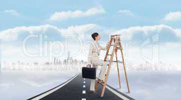 Composite image of businesswoman climbing career ladder with bri