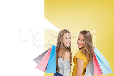 Composite image of two young women with shopping bags with speec