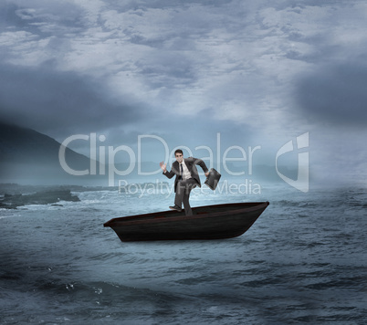 Composite image of happy businessman in a sailboat