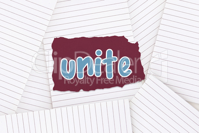 Unite against lined paper strewn over surface