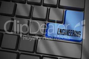 Engineering on black keyboard with blue key